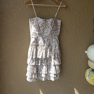 Strapless floral print ruffle skirt party dress.